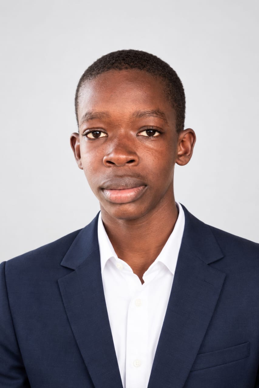 Portrait of Bodé Niangadou wearing a navy suit and white shirt